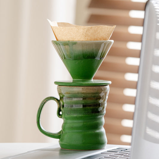 Japanese handcrafted rustic ceramic vintage coffee cup set for afternoon tea, pour-over coffee filter, and drip coffee maker.